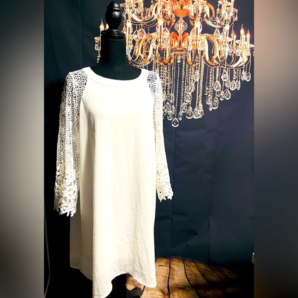 White dress, lined with crocheted sleeves